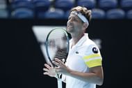 Filip Krajinovic in action against Daniil Medvedev at the 2021 Australian Open